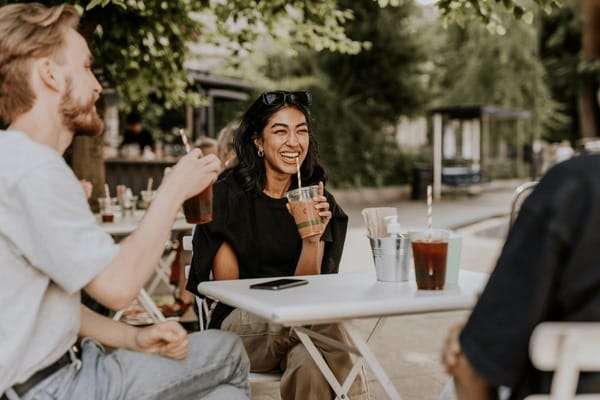 Friends laughing together at a meetup